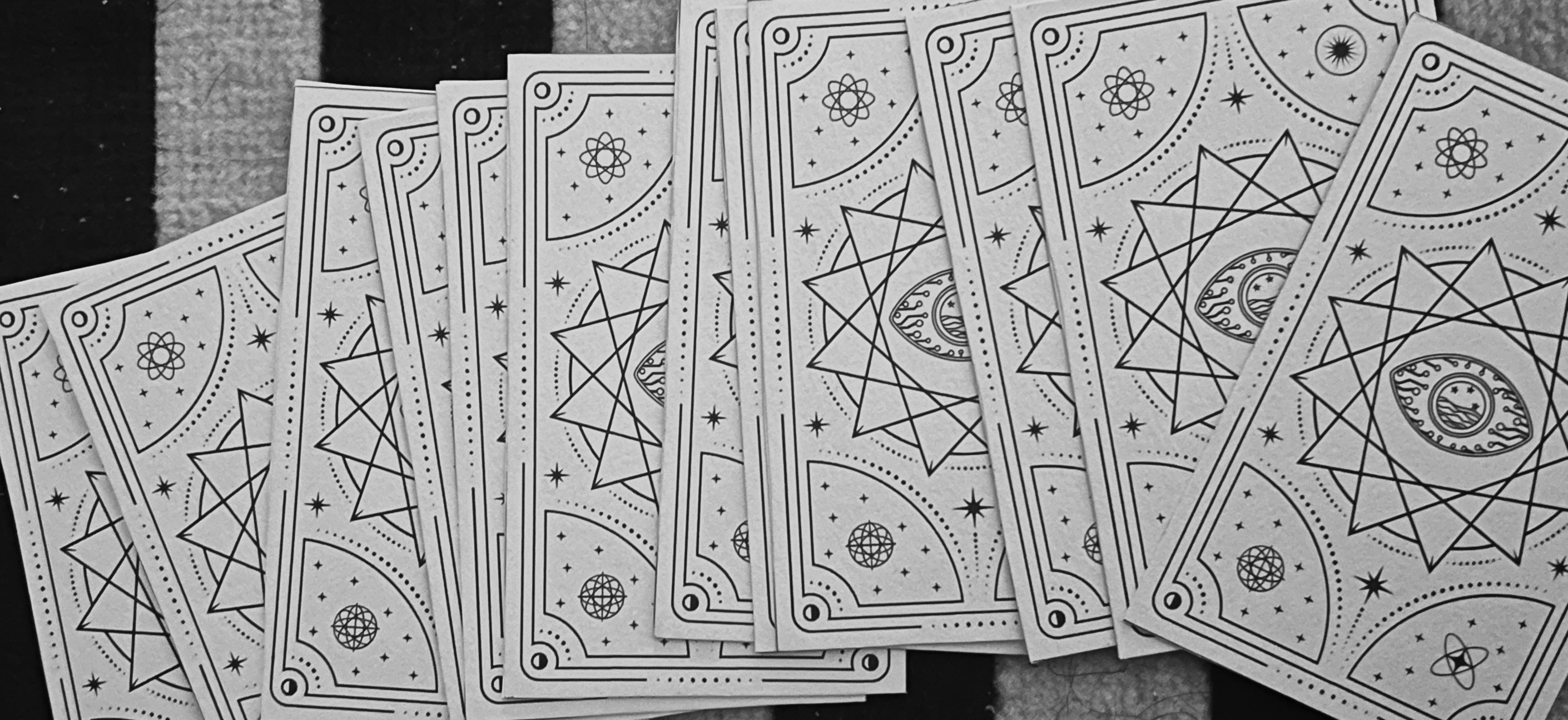 Printed Data-Driven Tarot cards arranged to show their patterned backs.